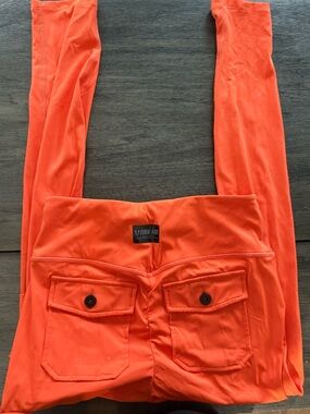 V-Firm Abs Women's Orange Leggings with Back Pocket Detail